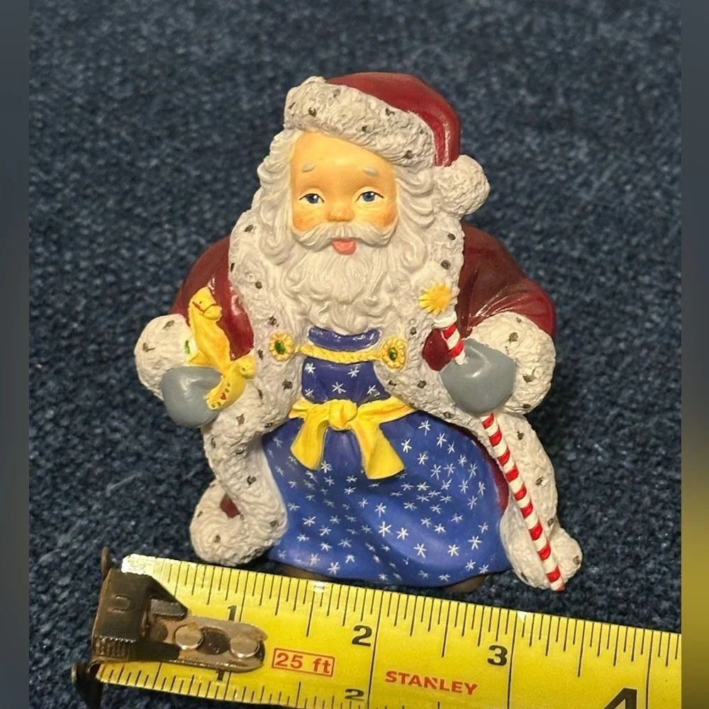 Small Santa with stars on his robe by Lenox’s Collectors Treasury of Santa’s.